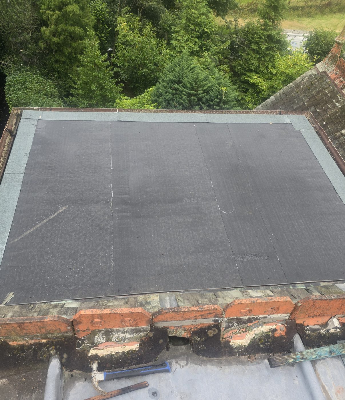 New flat roof with brick parapet
